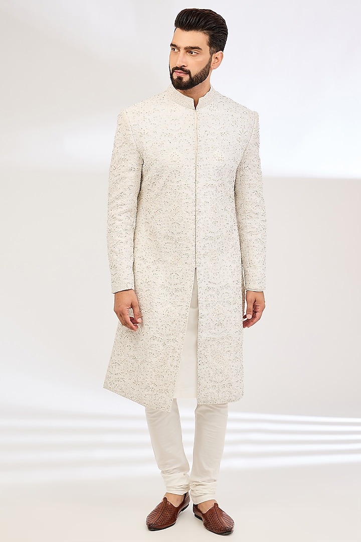 Ivory Raw Silk Embroidered Sherwani Set by NITIKA GUJRAL MEN