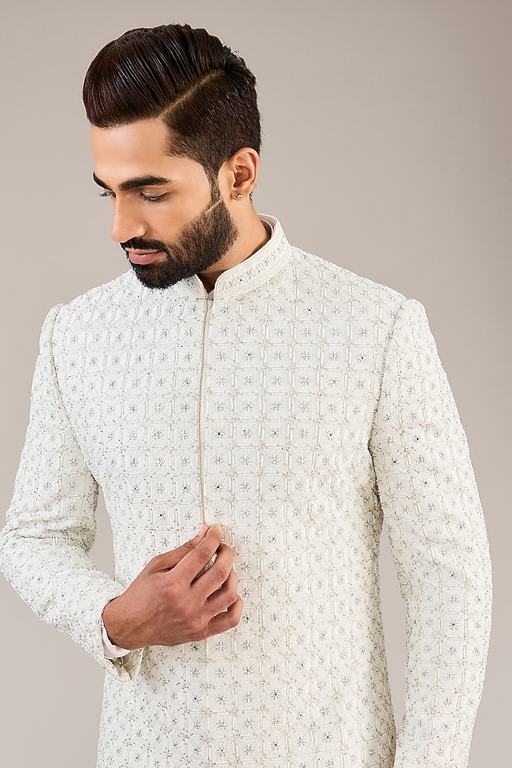 Ivory Raw Silk Resham & Cutdana Embroidered Groom Sherwani Set by NITIKA GUJRAL MEN at Pernia's Pop Up Shop
