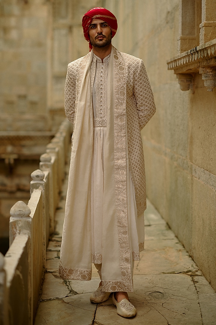 Cream Raw Silk Zari Embroidered Sherwani Set by NITIKA GUJRAL MEN