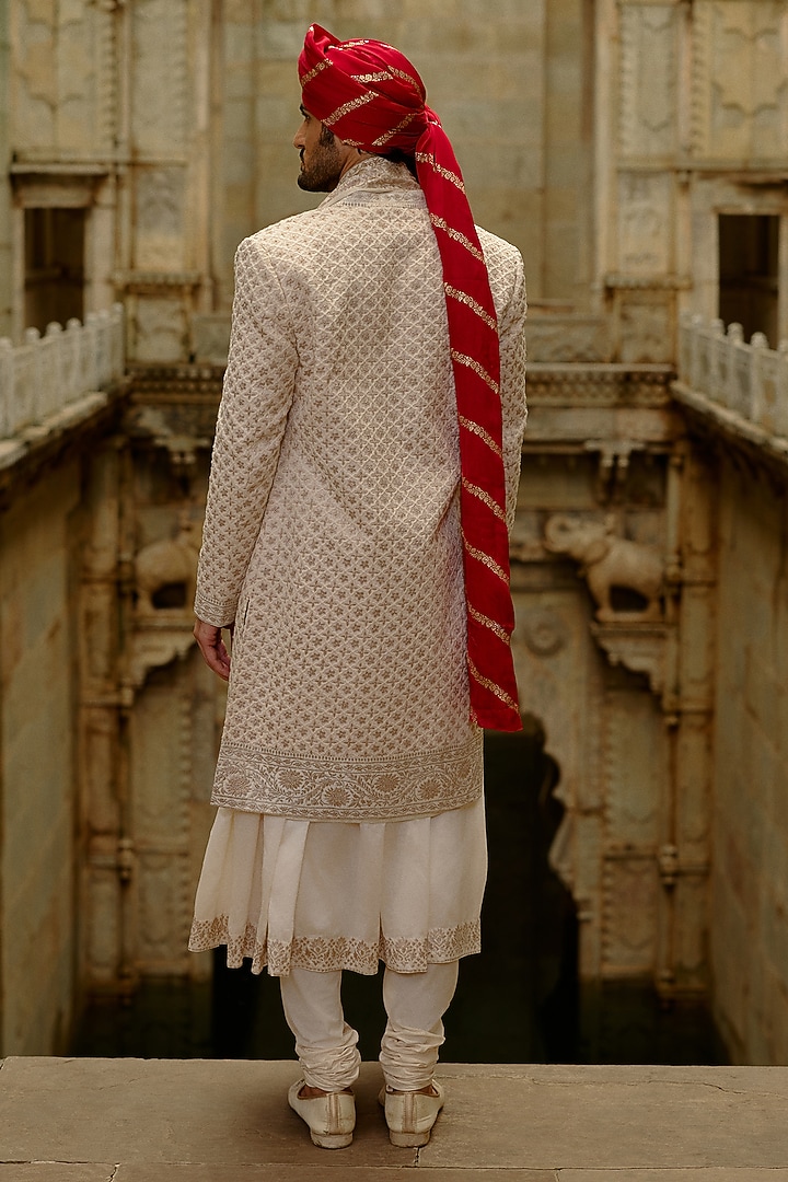 Cream Raw Silk Zari Embroidered Groom Sherwani Set by NITIKA GUJRAL MEN at Pernia's Pop Up Shop
