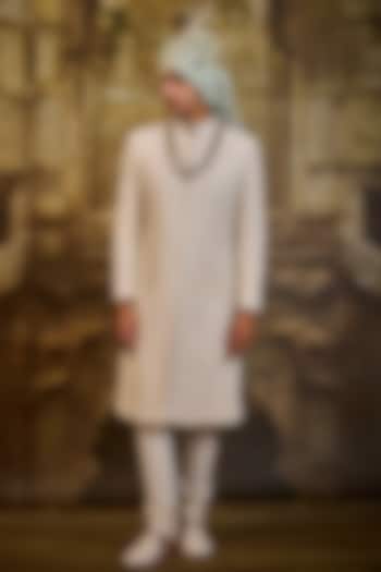Ivory Raw Silk & Cotton Silk Cutdana Embroidered Sherwani Set by NITIKA GUJRAL MEN