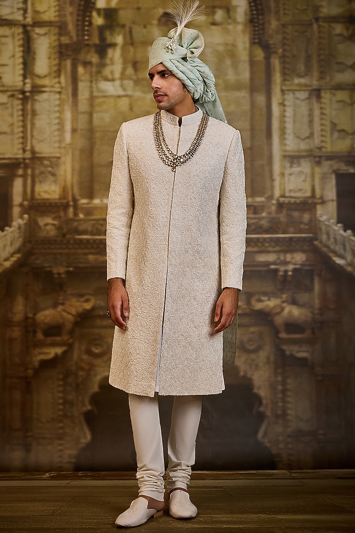 Ivory Raw Silk & Cotton Silk Cutdana Embroidered Sherwani Set by NITIKA GUJRAL MEN