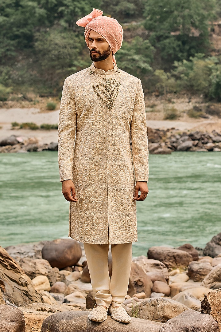 Champagne Gold Raw Silk Resham Embroidered Groom Sherwani Set by NITIKA GUJRAL MEN at Pernia's Pop Up Shop
