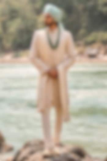 Ivory-Gold Matka Silk Zardosi Embroidered Groom Sherwani Set by NITIKA GUJRAL MEN at Pernia's Pop Up Shop