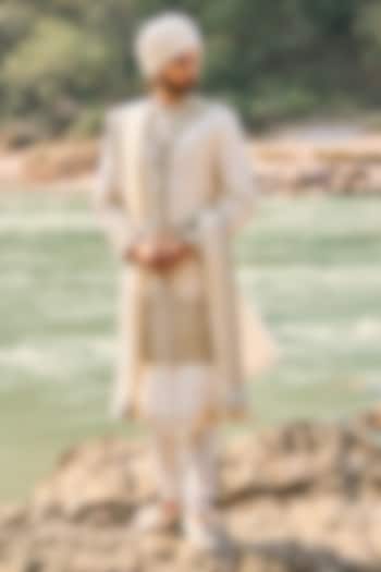 Ivory Raw Silk Resham Embroidered Groom Sherwani Set by NITIKA GUJRAL MEN at Pernia's Pop Up Shop