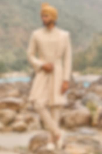Soft Peach Raw Silk Cutdana Embroidered Groom Sherwani Set by NITIKA GUJRAL MEN at Pernia's Pop Up Shop