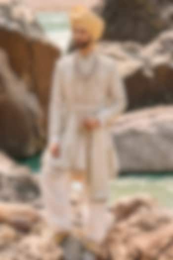 Ivory Raw Silk Dabka Embroidered Groom Sherwani Set by NITIKA GUJRAL MEN at Pernia's Pop Up Shop