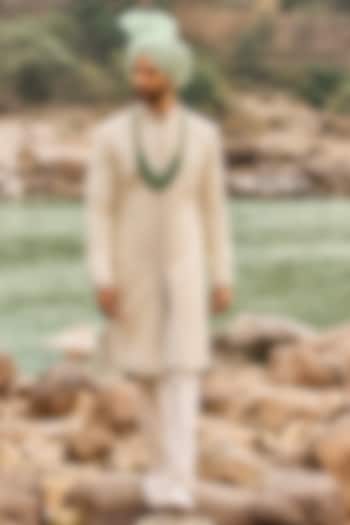Ivory Raw Silk Resham Embroidered Groom Sherwani Set by NITIKA GUJRAL MEN at Pernia's Pop Up Shop