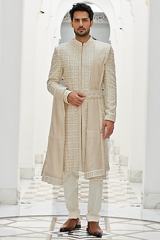 Cream Raw Silk Dabka & Sequins Embroidered Sherwani Set by NITIKA GUJRAL MEN