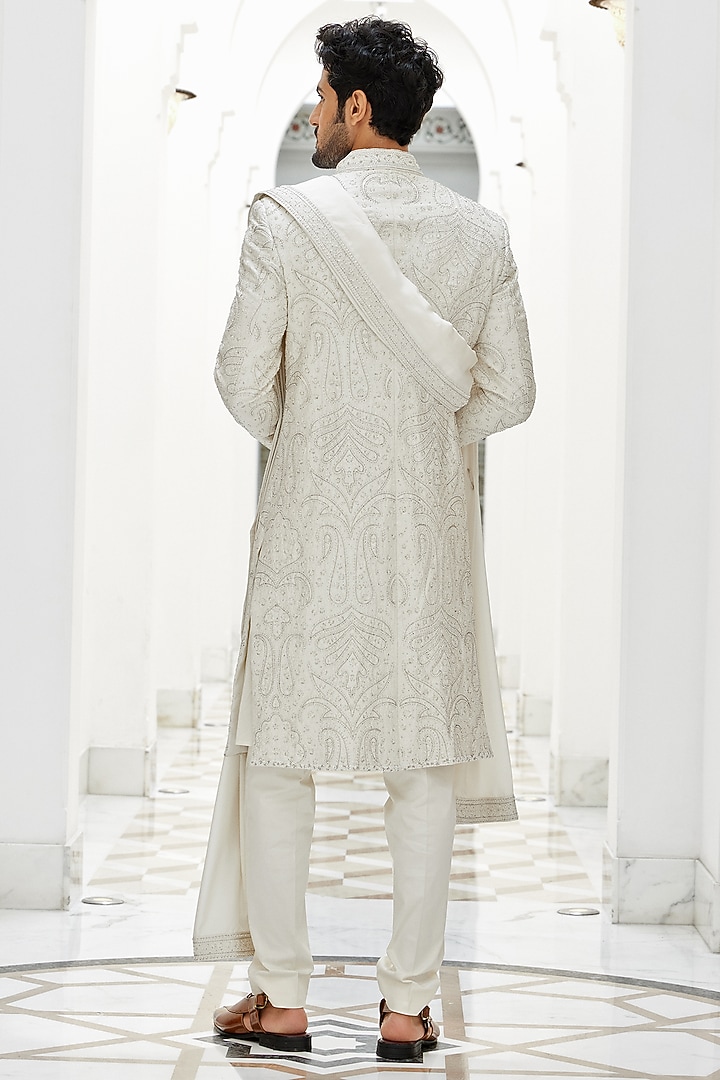 Ivory Raw Silk Dabka Beads Embroidered Groom Sherwani Set by NITIKA GUJRAL MEN at Pernia's Pop Up Shop