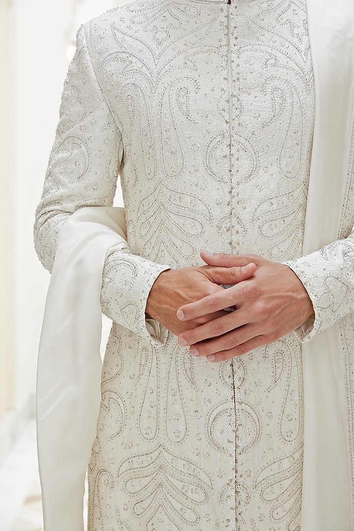 Ivory Raw Silk Dabka Beads Embroidered Groom Sherwani Set by NITIKA GUJRAL MEN at Pernia's Pop Up Shop