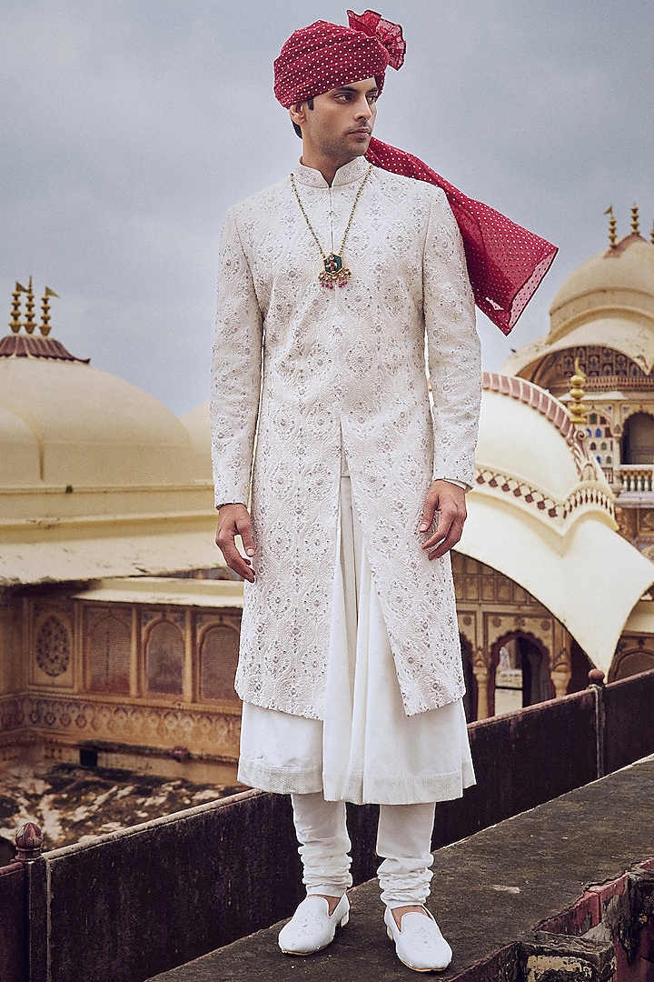 Ivory Raw Silk Resham & Dabka Embroidered Sherwani Set by NITIKA GUJRAL MEN