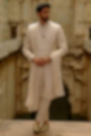 Beige Raw Silk Resham Embroidered Sherwani Set by NITIKA GUJRAL MEN