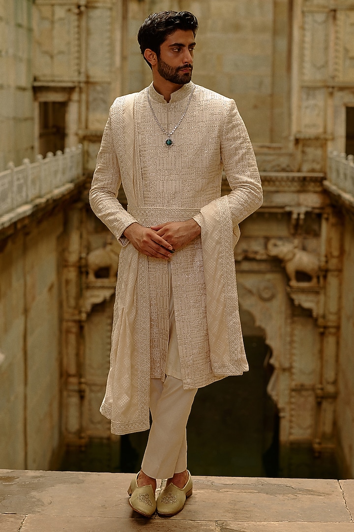 Beige Raw Silk Resham Embroidered Sherwani Set by NITIKA GUJRAL MEN
