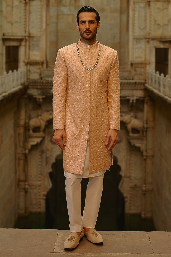 Peach Raw Silk Cutdana Embroidered Sherwani Set by NITIKA GUJRAL MEN