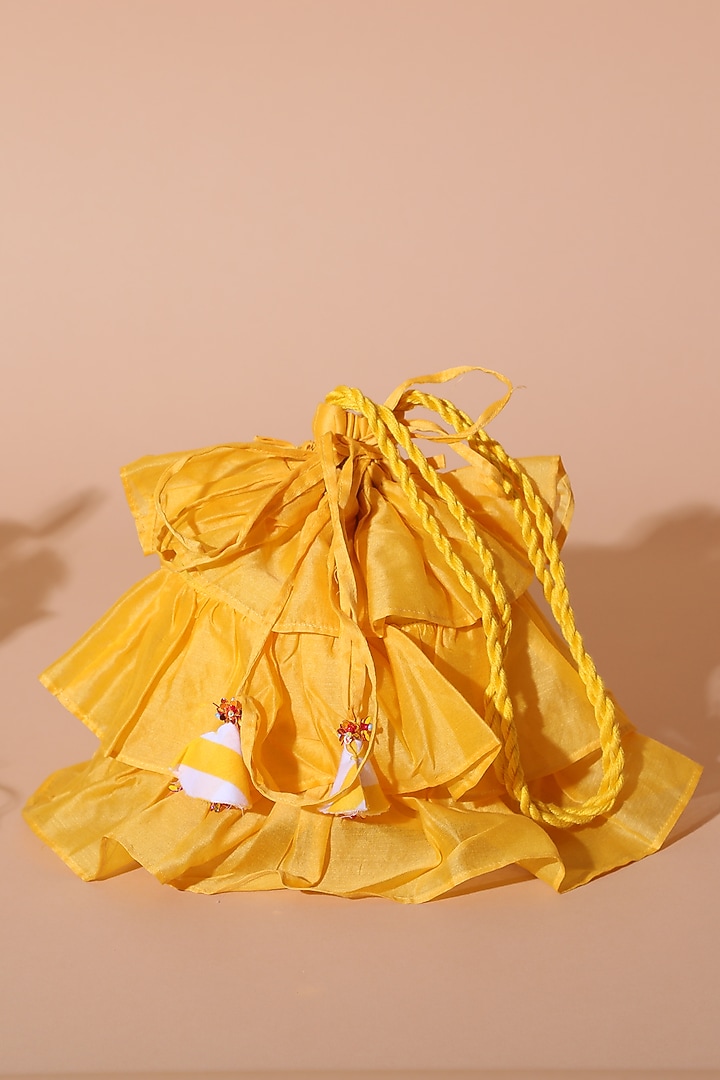 Yellow Chanderi Tiered Potli Bag by Nikasha at Pernia's Pop Up Shop
