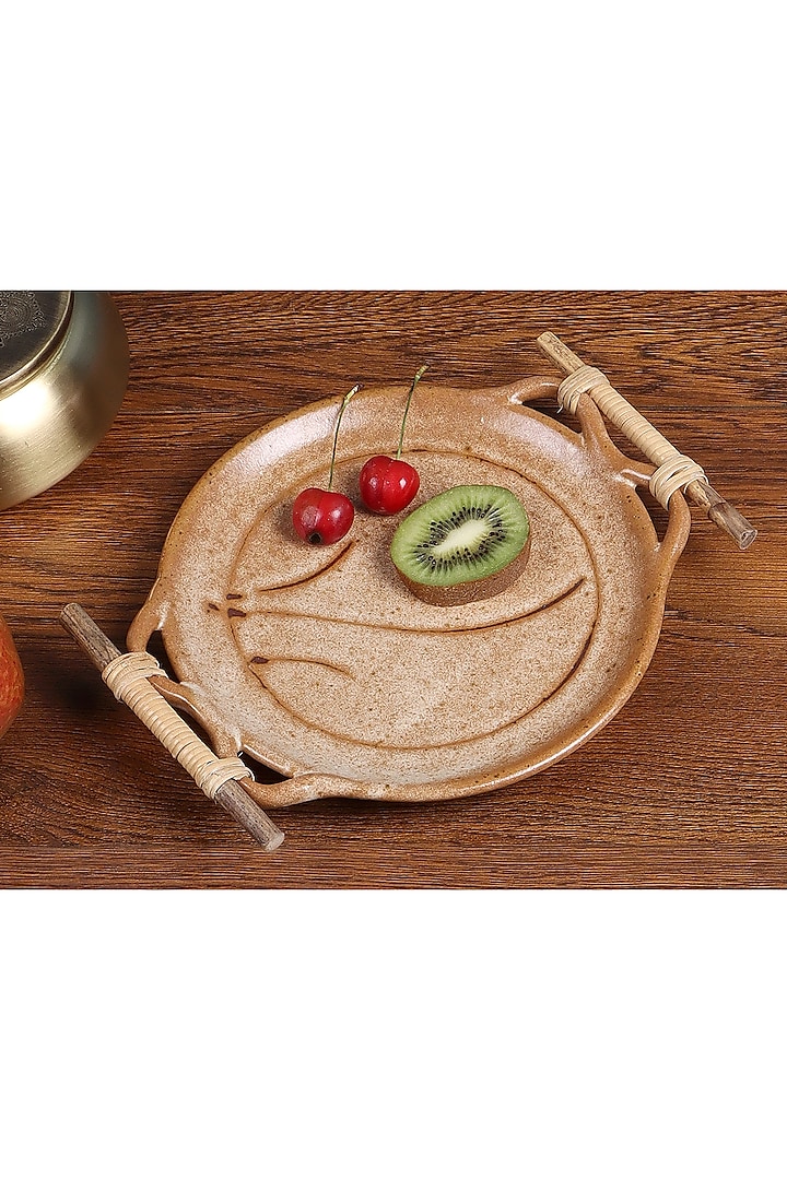 Beige Studio Pottery Round Platter With Cane Handle by Nakshikathaa