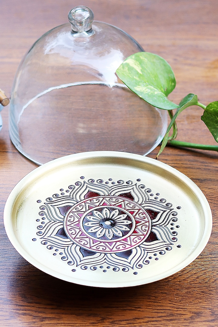 Gold Utsav Brass Cake Stand With Glass Cloche by Nakshikathaa at Pernia's Pop Up Shop