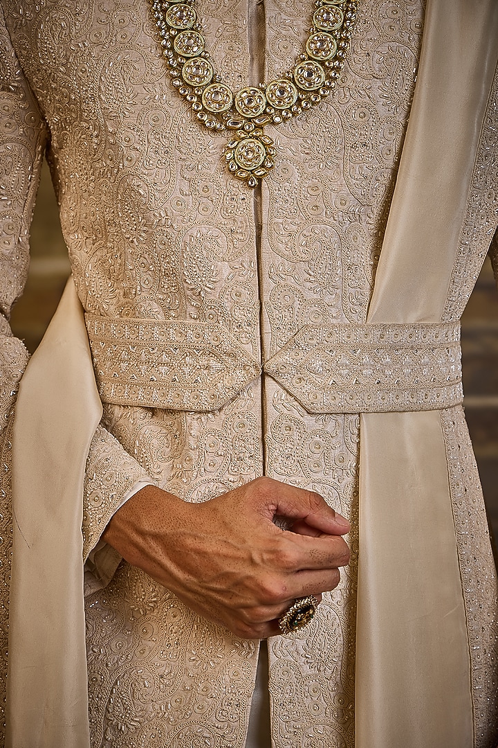 Ivory Raw Silk & Cotton Silk Cutdana Embroidered Groom Sherwani Set by NITIKA GUJRAL MEN at Pernia's Pop Up Shop