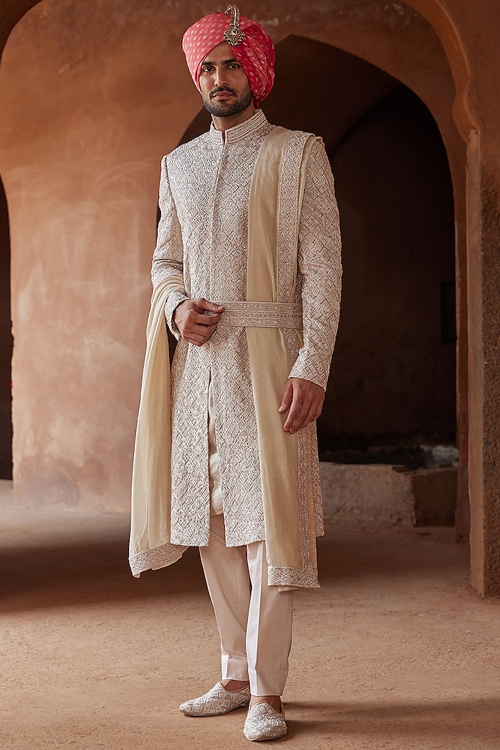 Ivory Raw Silk Embroidered Sherwani Set by NITIKA GUJRAL MEN