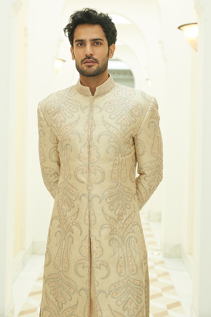 Beige Raw Silk Silver Beads Embroidered Groom Sherwani Set by NITIKA GUJRAL MEN at Pernia's Pop Up Shop