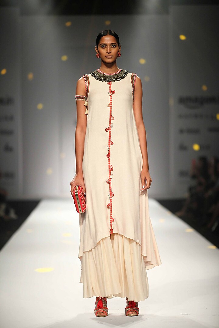 Ivory Asymmetric Embroidered Tassel Hanging Kurta with Matching Gathered Skirt by Nikasha