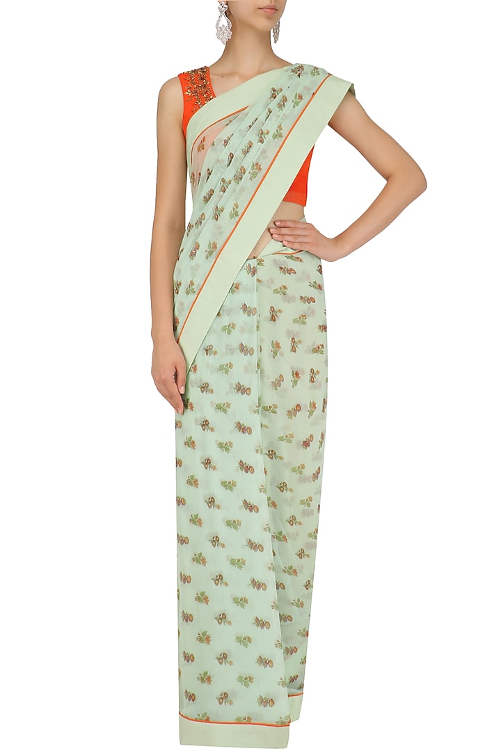 Blue floral print saree with orange embroidered blouse available only at Pernia's Pop Up Shop.
