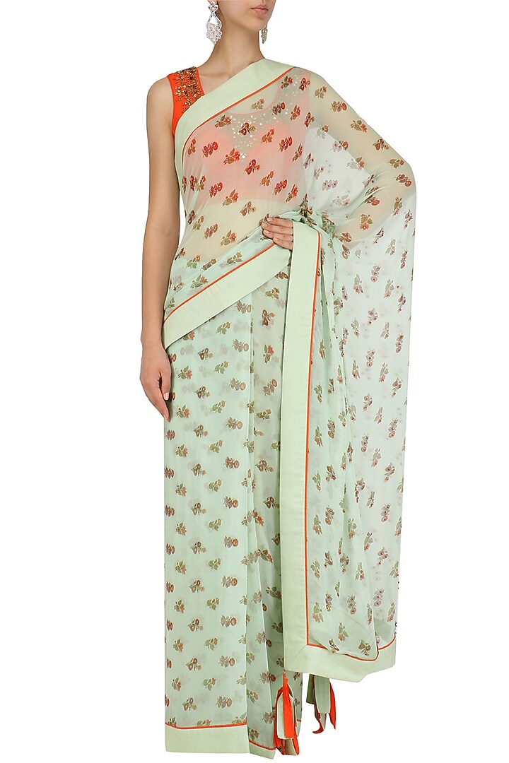 Blue floral print saree with orange embroidered blouse available only at Pernia's Pop Up Shop.