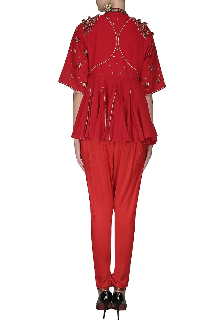 Red embroidered jacket with tube top and jodhpuri pants available only at Pernia's Pop Up Shop.