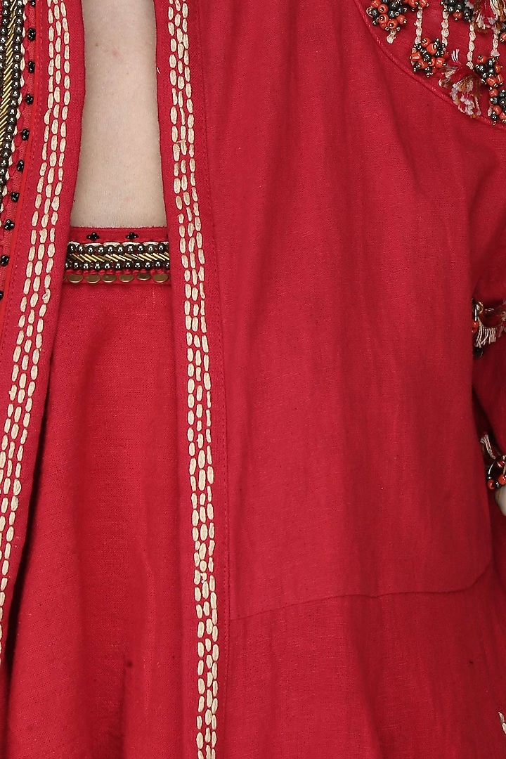 Red embroidered jacket with tube top and jodhpuri pants available only at Pernia's Pop Up Shop.