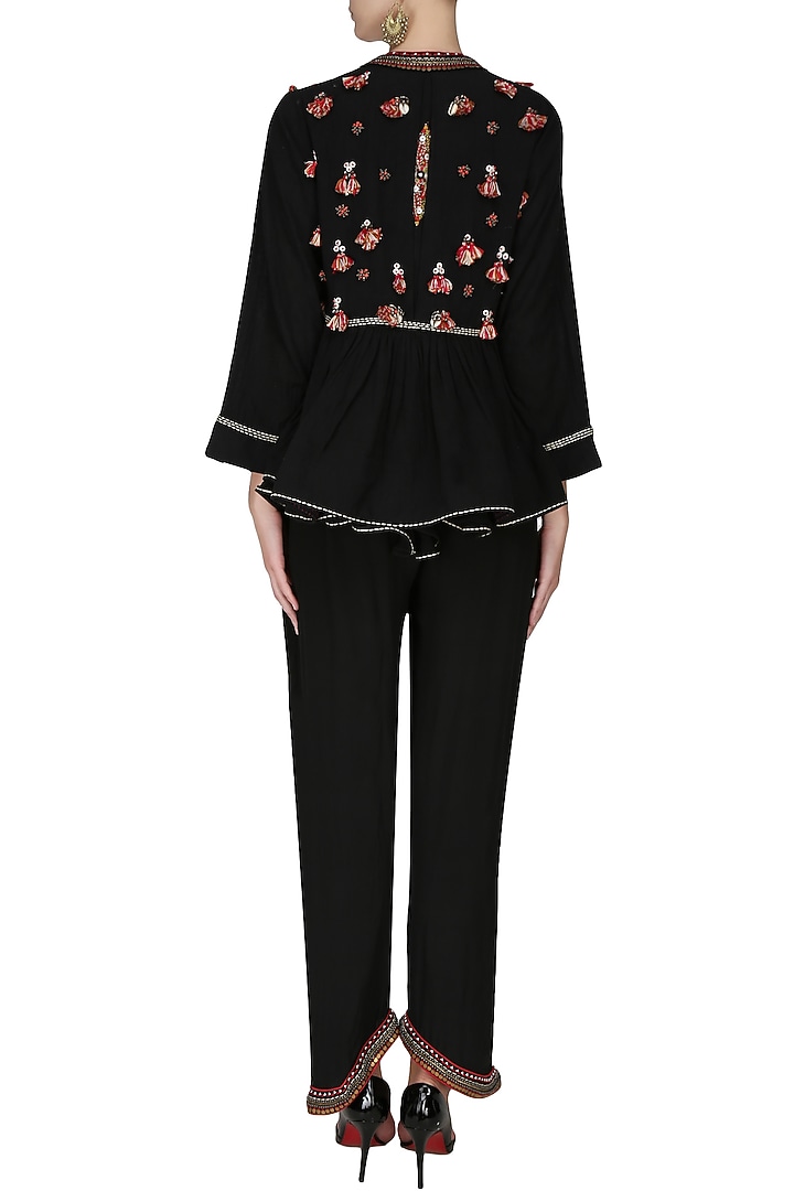 Black jumpsuit with black embroidered flared jacket available only at Pernia's Pop Up Shop.