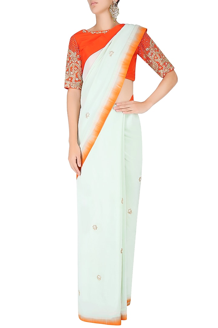 Mint embroidered motif saree with contrast red embellished blouse available only at Pernia's Pop Up Shop.
