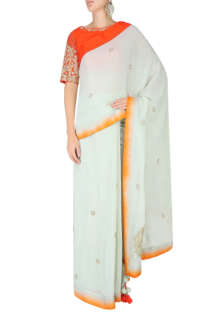 Mint embroidered motif saree with contrast red embellished blouse available only at Pernia's Pop Up Shop.