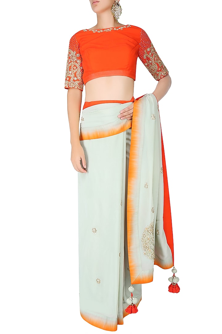 Mint embroidered motif saree with contrast red embellished blouse available only at Pernia's Pop Up Shop.