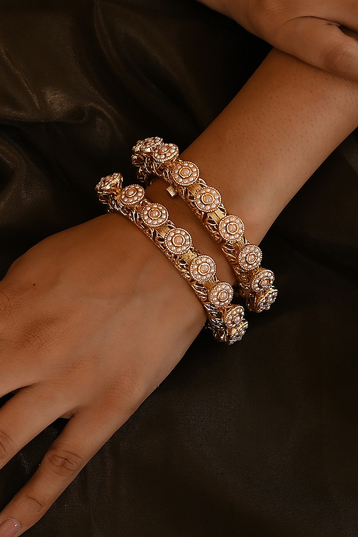 Micro Gold Finish Kundan Polki & Pearl Bangles (Set Of 2) by Namasya at Pernia's Pop Up Shop