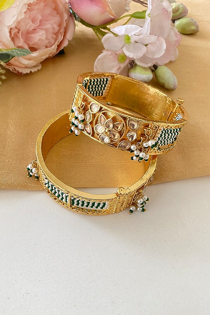 Micro Gold Finish Kundan Polki & Green Stone Bangles (Set Of 2) by Namasya at Pernia's Pop Up Shop