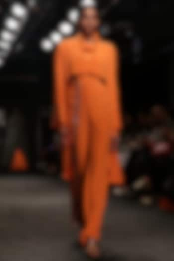 Tangerine high low coat with turtle neck body suit and bell bottom pants available only at Pernia's Pop Up Shop.