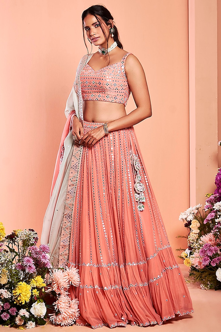 Coral Embroidered Tiered Lehenga Set by NIAMH by Kriti