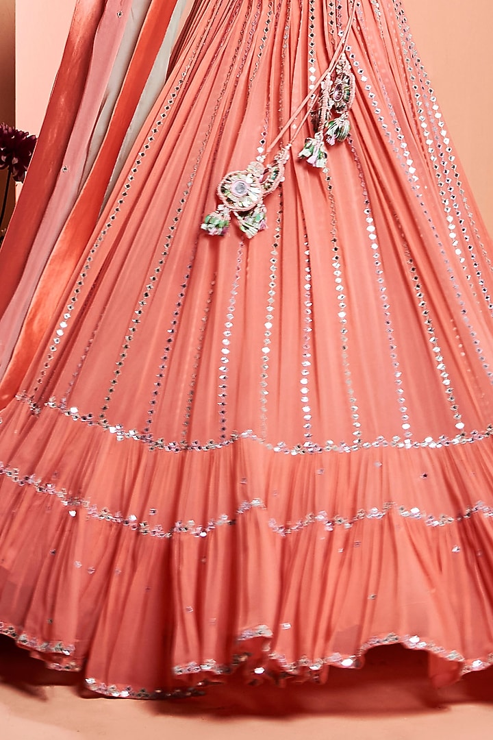 Coral Embroidered Tiered Wedding Lehenga Set by NIAMH by Kriti at Pernia's Pop Up Shop