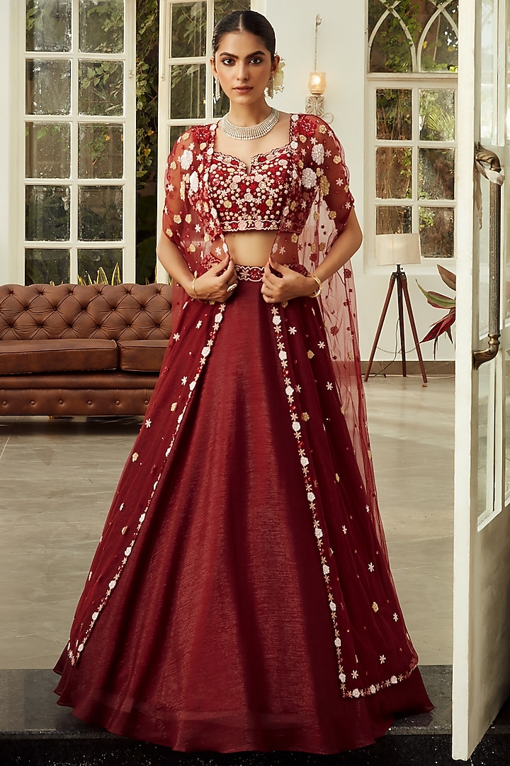 Mahogany Red Embroidered Cape Lehenga Set by NIAMH by Kriti