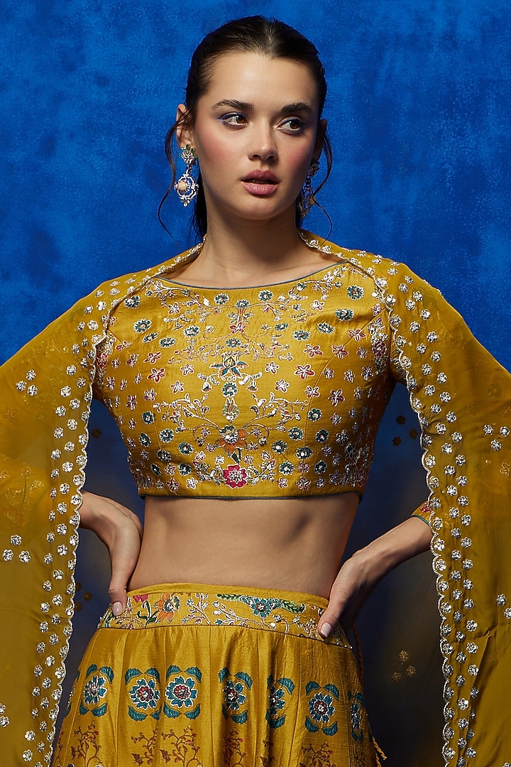 Mustard Soft Silk Floral Printed & Zari Embroidered Wedding Lehenga Set by Nautanky By Nilesh Parashar at Pernia's Pop Up Shop