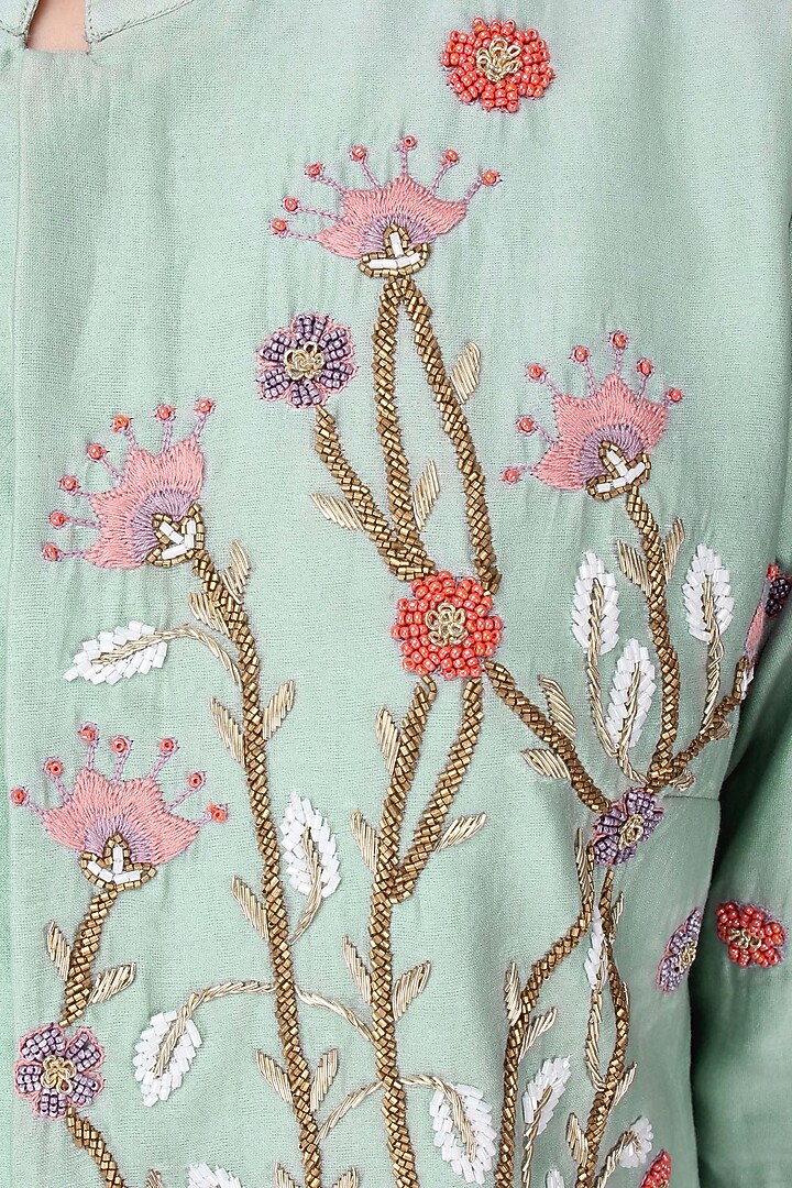Duck egg embroidered jacket with millenium pink ruffle skirt available only at Pernia's Pop Up Shop.