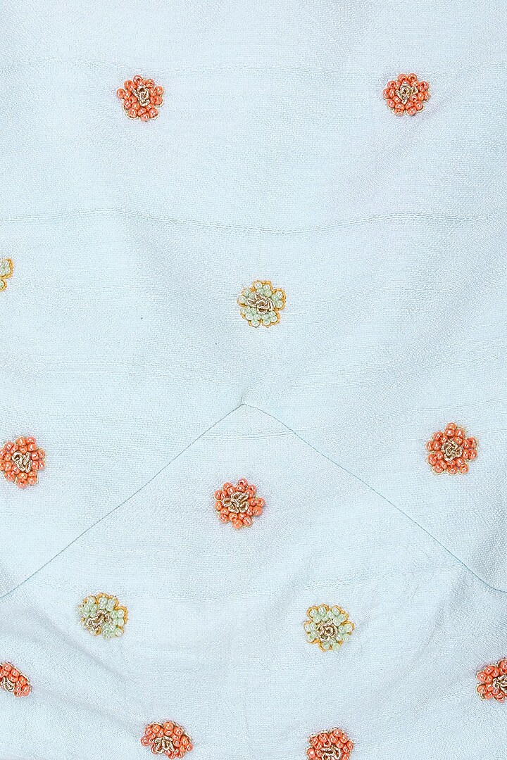 Powder blue embroidered crop top and asymmetric skirt available only at Pernia's Pop Up Shop.