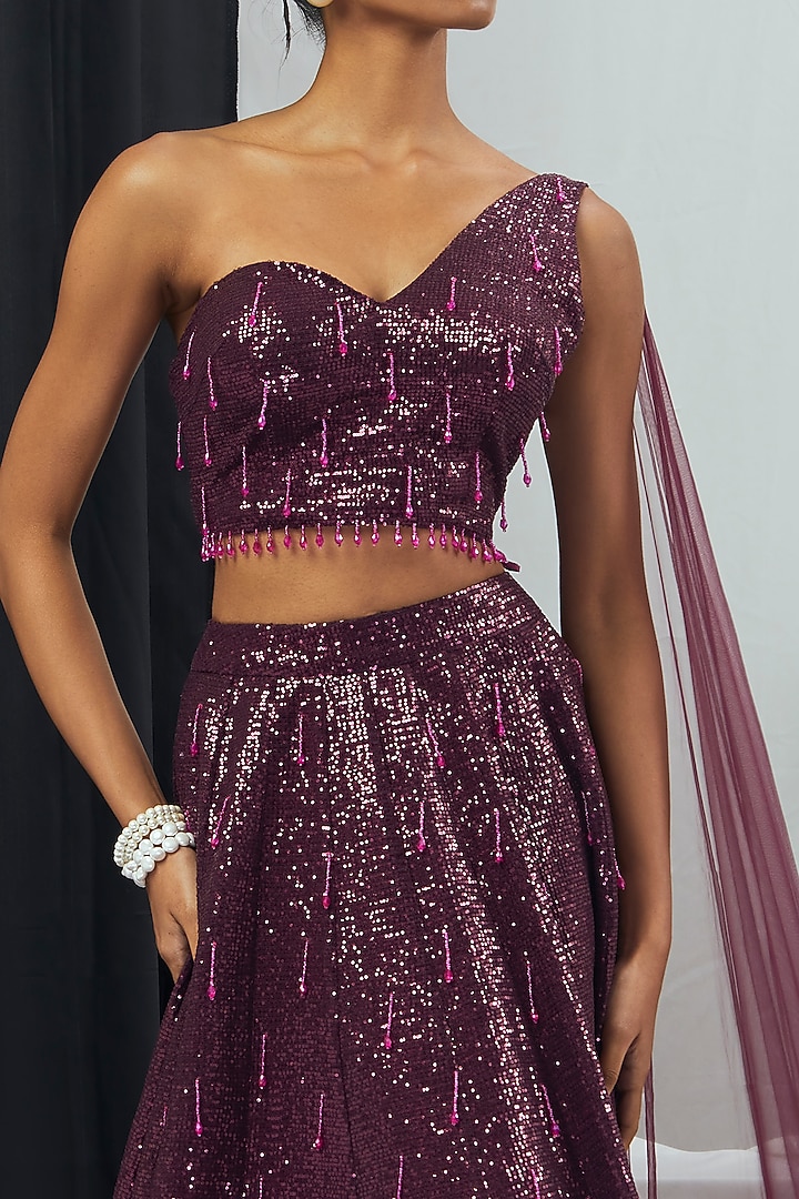Ruby Sequins Hand Embroidered Wedding Lehenga Set With Attached Dupatta by Nirmooha at Pernia's Pop Up Shop