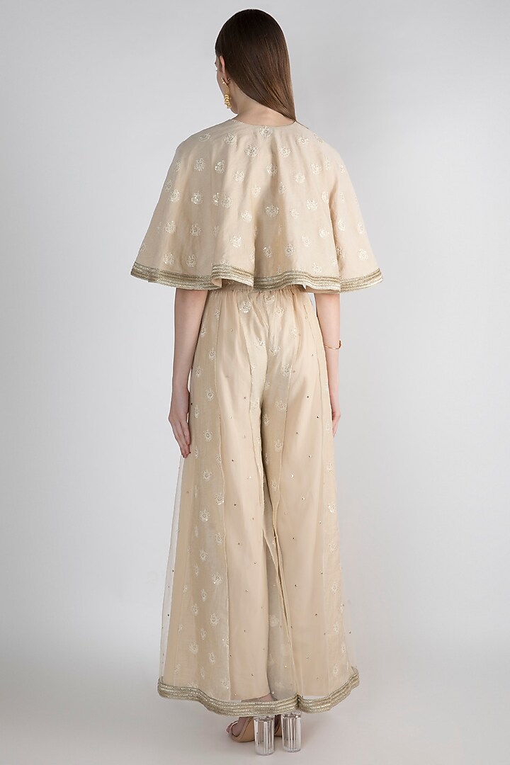 Beige Embroidered Poncho Cape With Palazzo Pants by Nirmooha at Pernia's Pop Up Shop