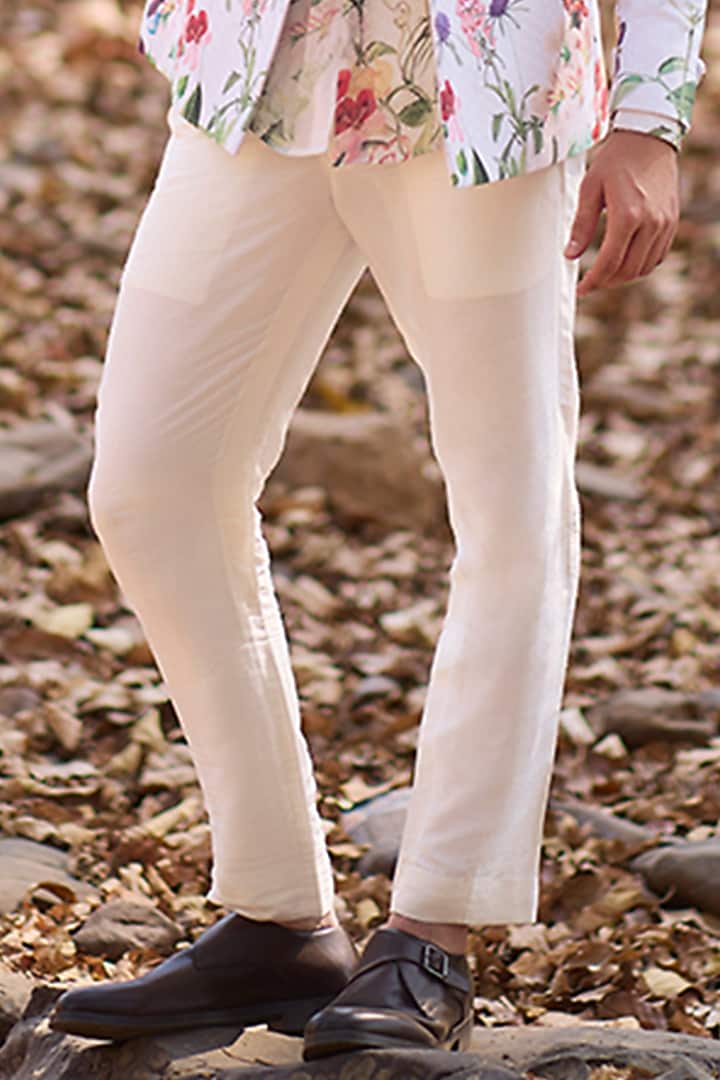 Ivory Nokia Silk Pants by Nirmooha Men at Pernia's Pop Up Shop