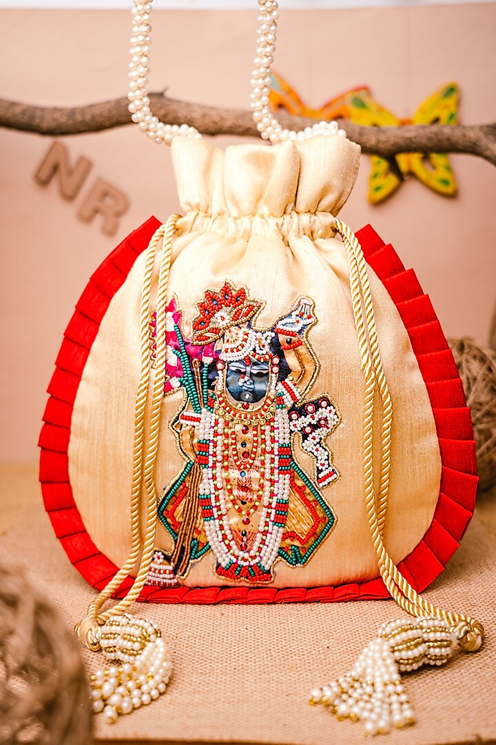 Cream Raw Silk Embroidered Potli by NR By Nidhi Rathi