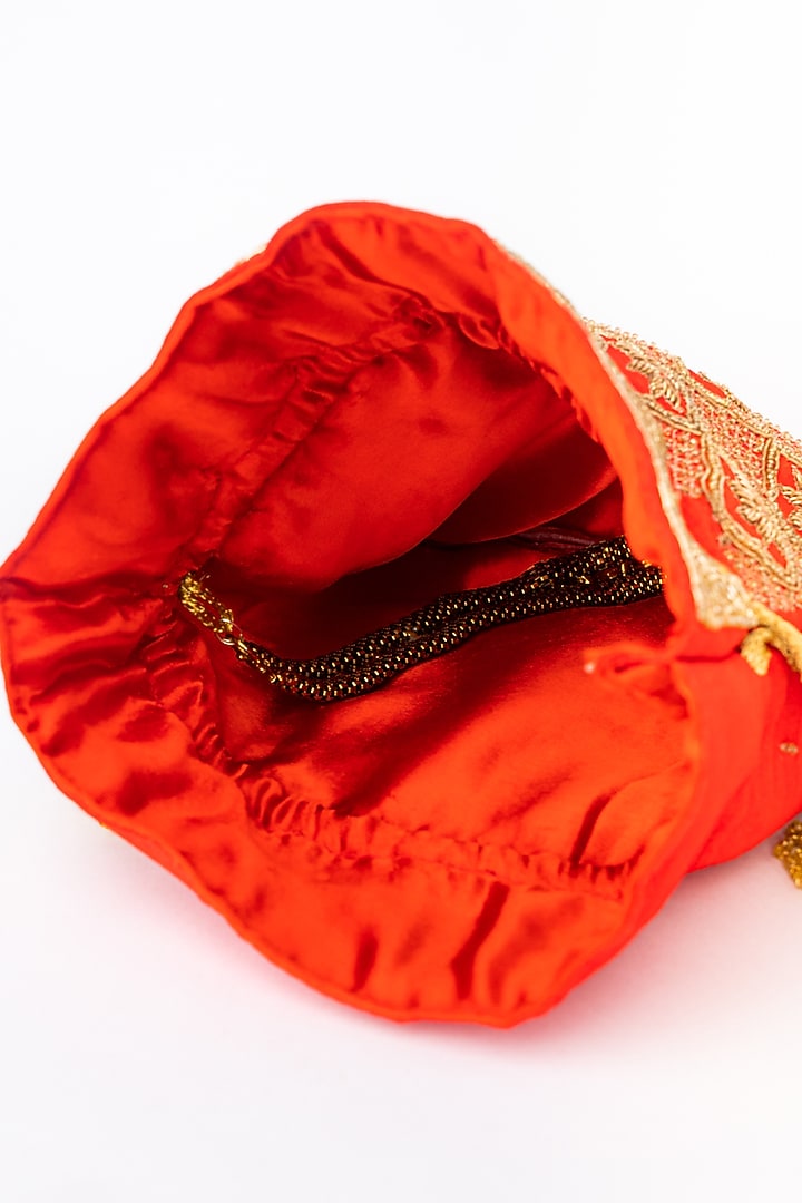 Red & Gold Raw Silk Embroidered Potli by NR By Nidhi Rathi at Pernia's Pop Up Shop