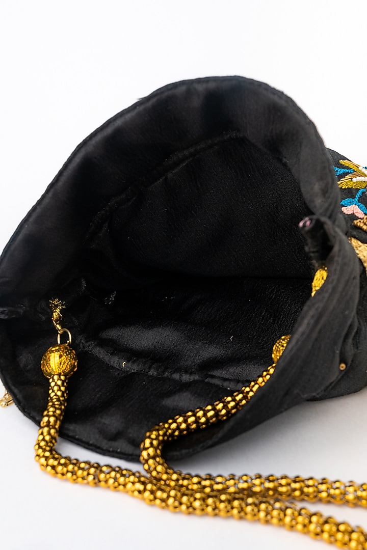 Black & Gold Raw Silk Embroidered Potli by NR By Nidhi Rathi at Pernia's Pop Up Shop