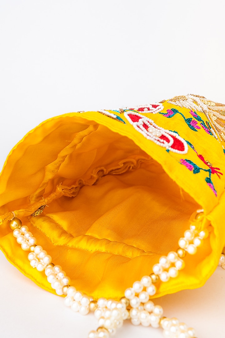 Yellow & Red Raw Silk Embroidered Potli by NR By Nidhi Rathi at Pernia's Pop Up Shop